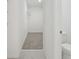 A long walk-in closet has white wire shelving and neutral carpet and tile floors at 2518 Linda Knoll Ln, Bartow, FL 33830