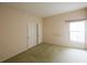 Bedroom featuring carpet, a window with blinds, and a closet at 2788 Roccella Ct, Kissimmee, FL 34747