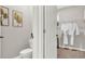 View of a half bath and walk-in closet with modern fixtures and neutral colors at 2825 Jamaica Way, Haines City, FL 33844