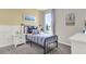 Stylishly decorated bedroom with ample natural light and coastal decor at 2825 Jamaica Way, Haines City, FL 33844