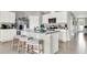 Modern kitchen with a central island, stainless steel appliances, and stylish bar stool seating at 2825 Jamaica Way, Haines City, FL 33844