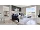 Open concept living room with large window, comfortable seating and decorative shelving at 2825 Jamaica Way, Haines City, FL 33844