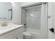 Bathroom featuring shower and tub combo, new tile and modern vanity at 2900 S Semoran Blvd # 4, Orlando, FL 32822