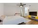 Bright bedroom features a ceiling fan, hard wood floors and ensuite bathroom at 2900 S Semoran Blvd # 4, Orlando, FL 32822