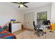 Bedroom featuring laminate wood floors, ceiling fan, closet and large window at 2900 S Semoran Blvd # 4, Orlando, FL 32822