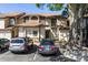 Two-story townhome with parking, neutral paint, and inviting front entrance at 2900 S Semoran Blvd # 4, Orlando, FL 32822