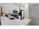 Modern kitchen featuring white cabinets, stainless steel appliances, and breakfast bar at 2900 S Semoran Blvd # 4, Orlando, FL 32822