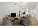 Inviting living room featuring two sofas and an open layout flowing into kitchen at 2900 S Semoran Blvd # 4, Orlando, FL 32822
