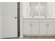 Bathroom featuring a double vanity, white cabinets, and modern fixtures, offering a clean and functional space at 2948 Wild Olive Dr, St Cloud, FL 34772