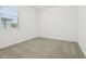A neutral carpeted bedroom with a window offering natural light at 2948 Wild Olive Dr, St Cloud, FL 34772