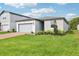 Beautiful single-Gathering home with brick-paved driveway, well-kept lawn, and stone facade at 2948 Wild Olive Dr, St Cloud, FL 34772