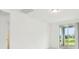 Minimalist interior with neutral walls, leading to a sliding glass door at 2948 Wild Olive Dr, St Cloud, FL 34772