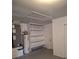 Unfinished basement featuring built in shelving, an access hatch and utilities at 3125 Timucua Cir, Orlando, FL 32837