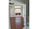 Spacious bedroom with hardwood floors, recessed lighting, a ceiling fan, and an adjoining bathroom with double vanities at 3125 Timucua Cir, Orlando, FL 32837