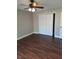 Cozy bedroom with wood-look flooring, closet, and ceiling fan at 3125 Timucua Cir, Orlando, FL 32837