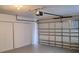 An empty garage featuring a door, sliding closet, and garage door at 3125 Timucua Cir, Orlando, FL 32837