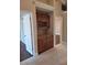 Hallway featuring built-in cabinets with a granite countertop and tiled floors at 3125 Timucua Cir, Orlando, FL 32837