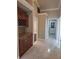 Hallway featuring built-in cabinets and granite countertop plus tiled floors at 3125 Timucua Cir, Orlando, FL 32837