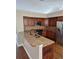Well-equipped kitchen with granite countertops, stainless steel appliances, and wood-look flooring at 3125 Timucua Cir, Orlando, FL 32837