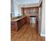 Stylish kitchen with stainless steel appliances, dark wood cabinets, and an island with granite countertop at 3125 Timucua Cir, Orlando, FL 32837