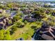 Aerial view showcasing a community with mature landscaping, lake views and community green space at 366 Waterside Dr # 102, Altamonte Springs, FL 32701