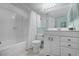 Bathroom featuring a vanity with storage, framed mirror, and a shower-tub combo at 366 Waterside Dr # 102, Altamonte Springs, FL 32701