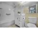 Bright bathroom featuring a vanity with storage, framed mirror, and a shower-tub combo at 366 Waterside Dr # 102, Altamonte Springs, FL 32701