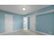 Bedroom with two doors and fresh turquoise-painted walls at 366 Waterside Dr # 102, Altamonte Springs, FL 32701