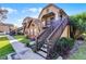 Attractive townhome facade with brick detail, stair access to upper units, and well-maintained landscaping at 366 Waterside Dr # 102, Altamonte Springs, FL 32701