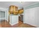 Bright kitchen with wood cabinets, stainless steel refrigerator, and adjacent to a dining area at 366 Waterside Dr # 102, Altamonte Springs, FL 32701