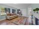 Bright living room with hardwood floors, a comfortable couch, and a decorative area rug at 366 Waterside Dr # 102, Altamonte Springs, FL 32701
