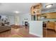 Cozy living space with hardwood floors, fireplace, and open access to the kitchen, creating a seamless flow at 366 Waterside Dr # 102, Altamonte Springs, FL 32701