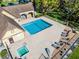 A beautiful community pool with a hot tub is surrounded by lounge chairs at 366 Waterside Dr # 102, Altamonte Springs, FL 32701