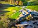 Aerial view of the building featuring the nearby golf course and parking at 398 Troon Ct, Winter Haven, FL 33884
