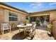 Charming outdoor patio area with brick pavers, seating, and access to the sunroom at 398 Troon Ct, Winter Haven, FL 33884
