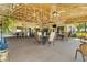 Large outdoor patio with ample seating, perfect for dining and entertaining in a serene setting at 398 Troon Ct, Winter Haven, FL 33884