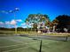 Enjoy the outdoors on this well-maintained tennis court with lights at 398 Troon Ct, Winter Haven, FL 33884