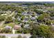 An aerial view of the neighborhood showcasing houses, mature trees, and beautiful landscape at 427 N Lakeview Ave, Winter Garden, FL 34787