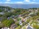 An aerial view showing the home's proximity to a large body of water and lush green surroundings at 427 N Lakeview Ave, Winter Garden, FL 34787