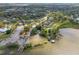 Wide aerial view of a residential neighborhood near a lake, highlighting a boat launch area at 427 N Lakeview Ave, Winter Garden, FL 34787