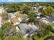 Aerial perspective showcasing the property with a pool, nestled among lush greenery in a waterfront community at 427 N Lakeview Ave, Winter Garden, FL 34787