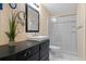 Bathroom featuring tiled shower, vanity, decorative mirror and vessel sink at 427 N Lakeview Ave, Winter Garden, FL 34787