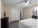 Bedroom featuring neutral walls, ceiling fan, plush carpet, and ensuite bathroom at 427 N Lakeview Ave, Winter Garden, FL 34787