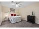 Well-lit bedroom featuring neutral walls, ceiling fan and accent furniture at 427 N Lakeview Ave, Winter Garden, FL 34787