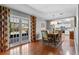 Dining room features hardwood floors and doors to the backyard pool at 427 N Lakeview Ave, Winter Garden, FL 34787