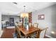 Dining room has wood floors with backyard view at 427 N Lakeview Ave, Winter Garden, FL 34787