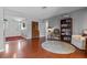 Welcoming entryway with hardwood floors and white front door with decorative side panels at 427 N Lakeview Ave, Winter Garden, FL 34787