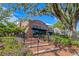 Charming two-story red brick building with 'Plant Street' sign and patio dining beneath a large tree at 427 N Lakeview Ave, Winter Garden, FL 34787