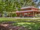Inviting brown building with covered porch and lush landscaping, perfect for outdoor enjoyment at 427 N Lakeview Ave, Winter Garden, FL 34787
