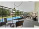 Relaxing enclosed lanai with comfortable seating, perfect for poolside lounging at 427 N Lakeview Ave, Winter Garden, FL 34787